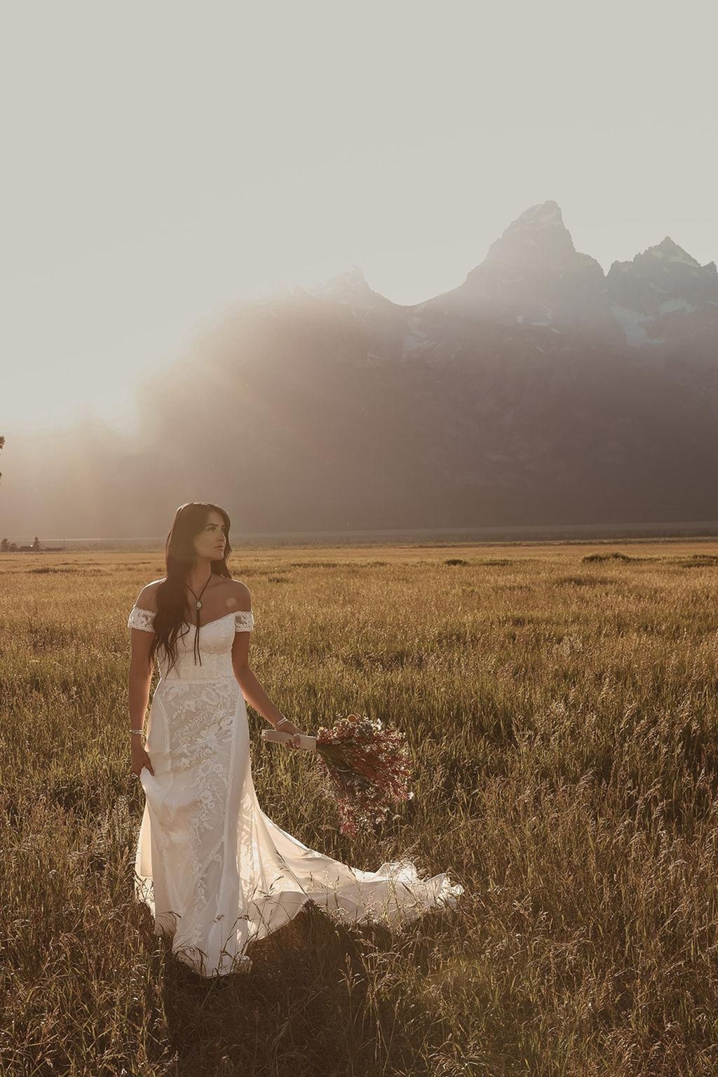 Wedding dress with expressive lace detailing that tells a story through texture and craftsmanship rather than decorative embellishment